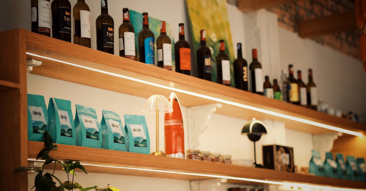 Бизнес-план кафе 1 Warm and inviting cafe shelf with wine bottles and coffee bags, creating a cozy atmosphere.