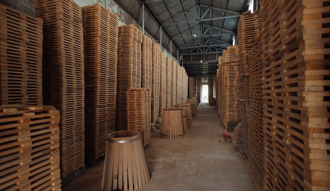 A warehouse filled with stacks of wooden barrel staves, showcasing industrial storage.