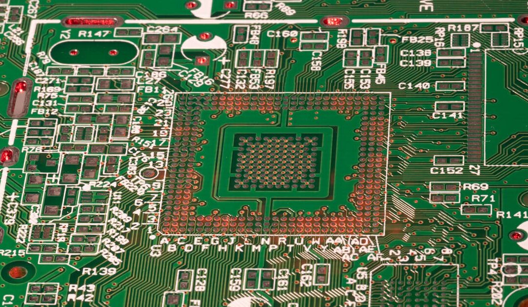 Detailed view of a green printed circuit board with visible components and connections.