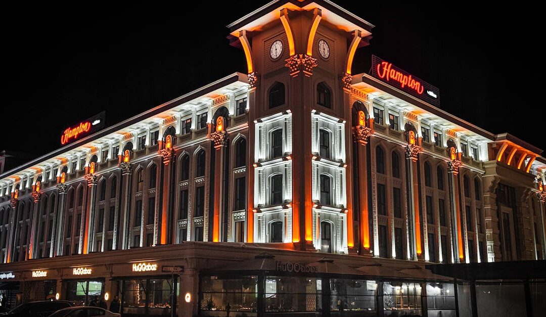Stunning night view of an illuminated hotel facade in Sakarya, Turkey, showcasing vibrant architectural lighting.