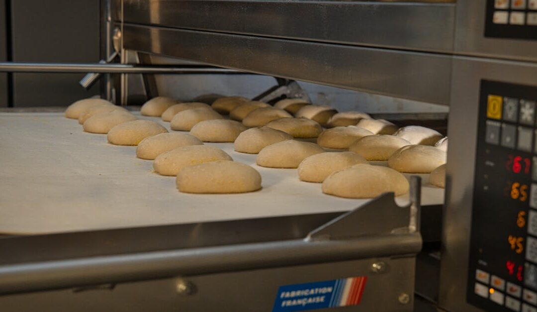 Artisan bread baking in an industrial oven at a bakery in Berlin, Germany. Fresh and delicious.