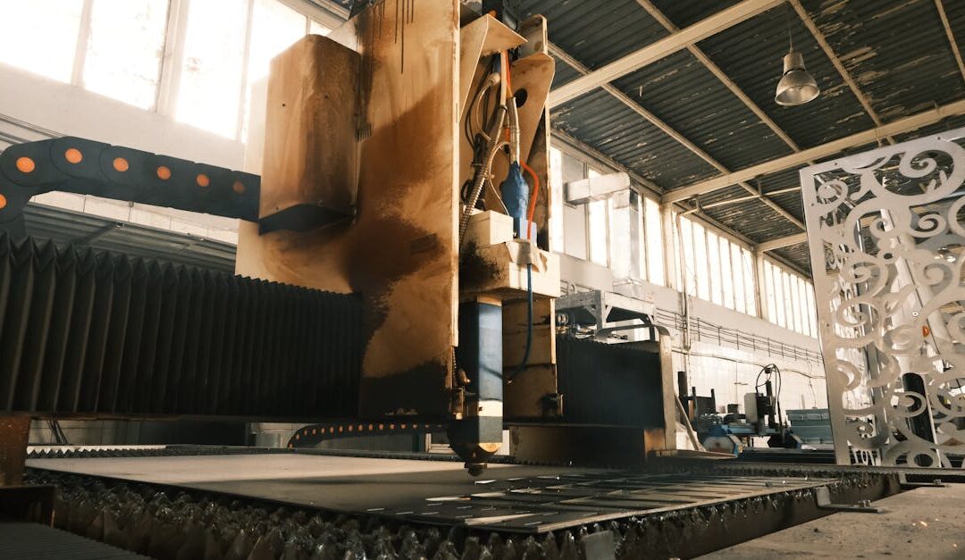 Close-up of a laser cutter in an industrial factory, showcasing modern manufacturing technology.