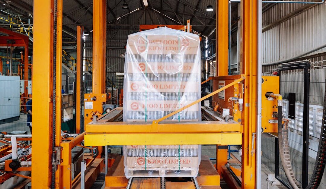 An industrial machine in a glass factory showcasing automated packaging in Dar es Salaam.