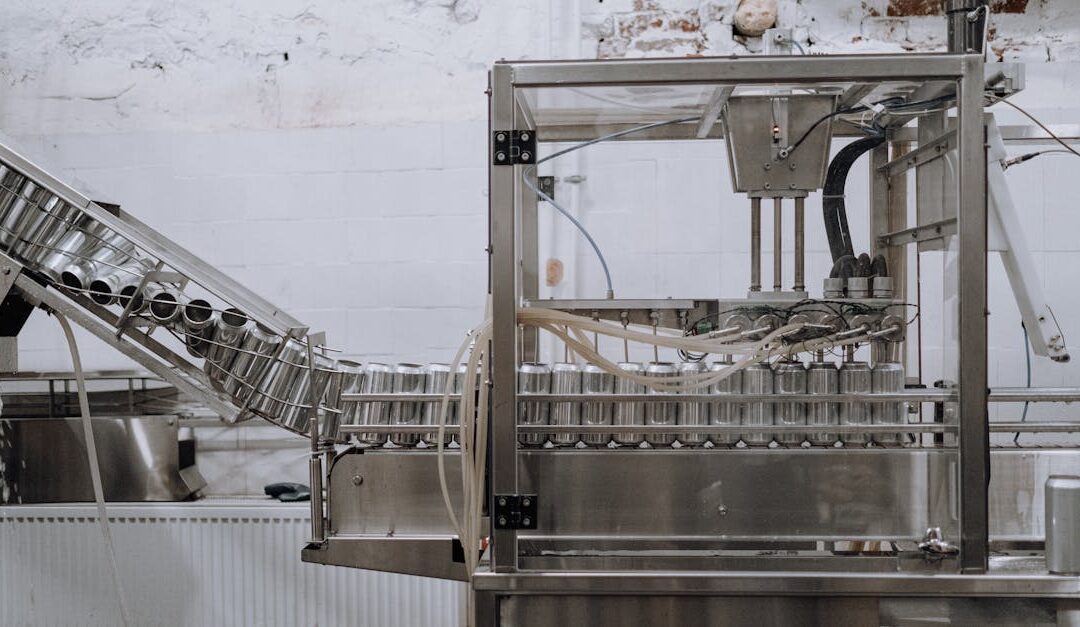 Automated beverage can packaging in a modern factory setting.
