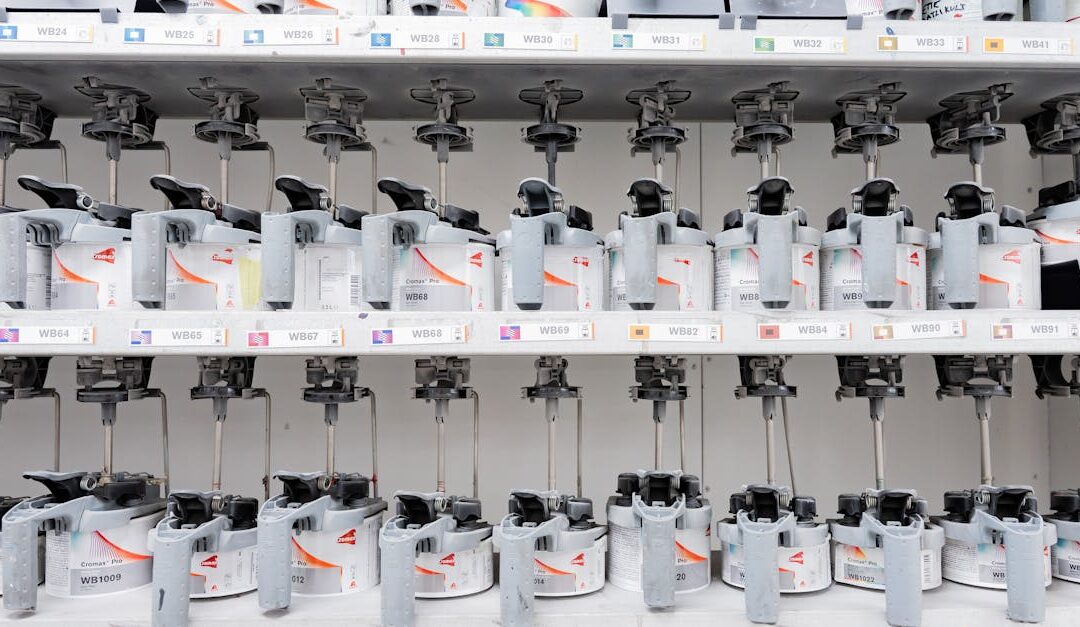 Organized industrial paint mixer station with multiple dispensers for accurate color mixing.
