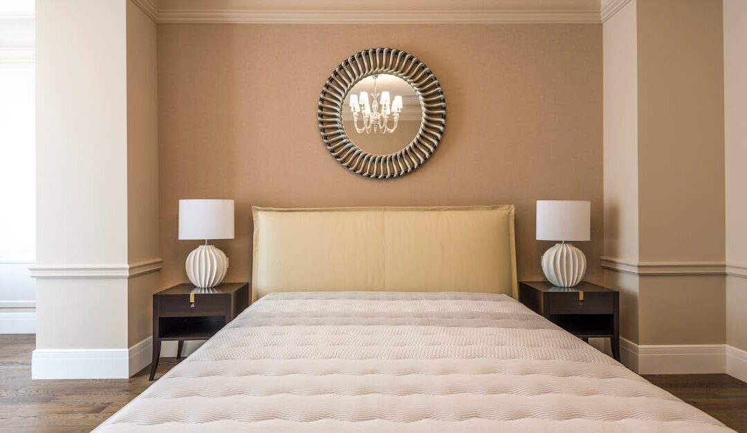 Stylish bedroom featuring a modern bed, elegant decor, and symmetrical lighting.