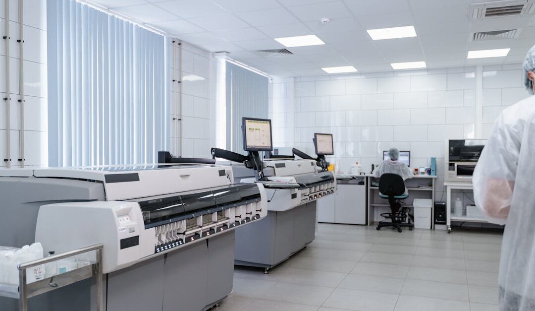 Bright and sterile laboratory featuring high-tech research equipment and professionals at work.