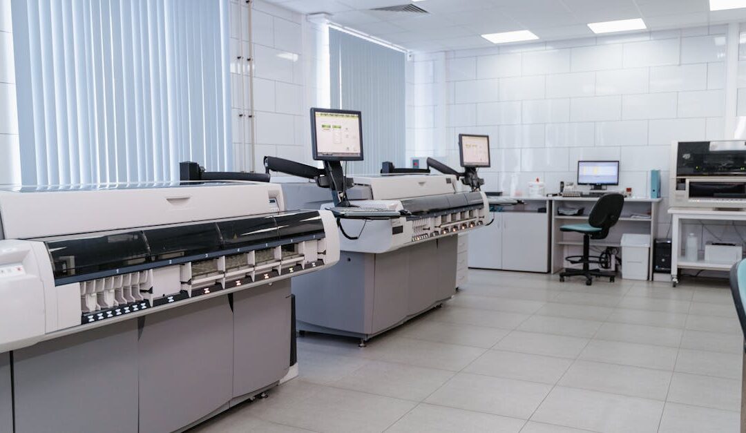 Spacious laboratory interior featuring state-of-the-art machines and computers for research purposes.