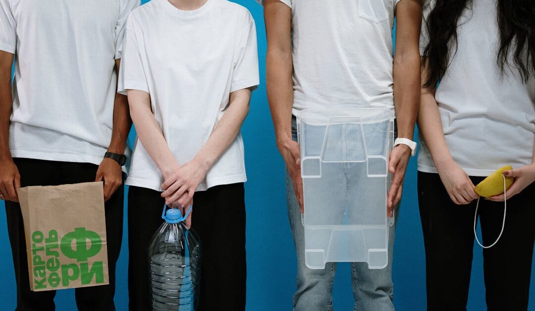 Four adults wearing makeshift protective gear against a blue backdrop.