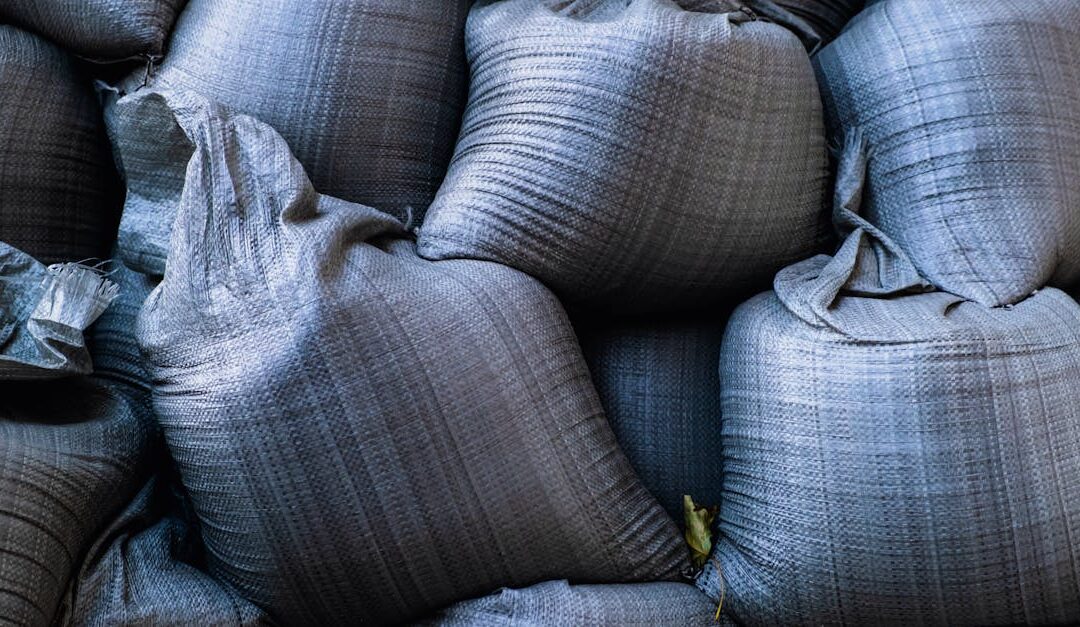 Close-up of stacked sandbags used for flood protection and emergency management.