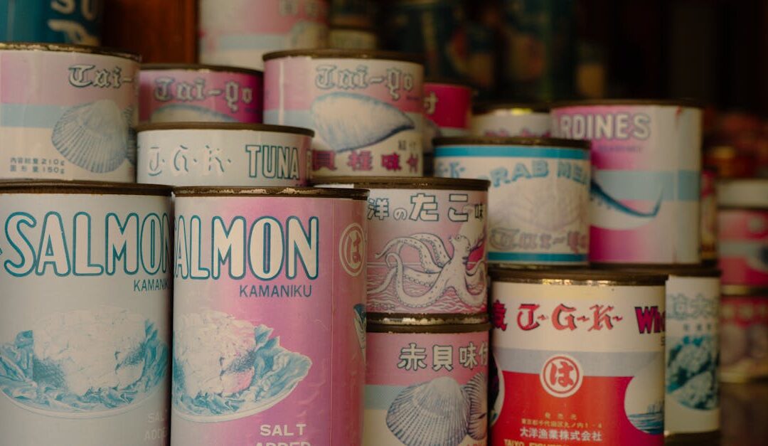 Vintage cans of Japanese seafood including salmon and tuna, displayed in a Tokyo shop.