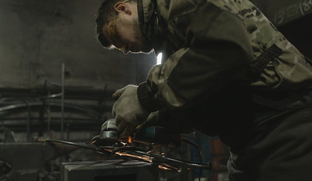 A craftsman skillfully operating a grinder, sparks flying, in an industrial workshop setting.